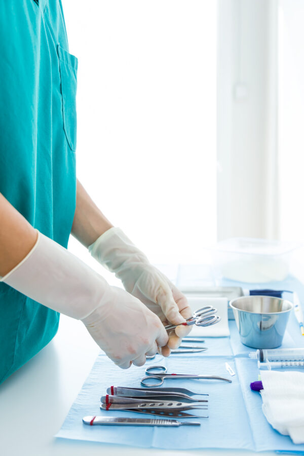 Doctor with many kind of medical equipment manage for to start o